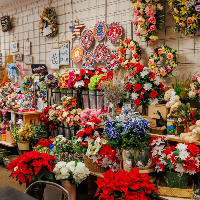 Floral shop display filled with colorful bouquets and wreaths